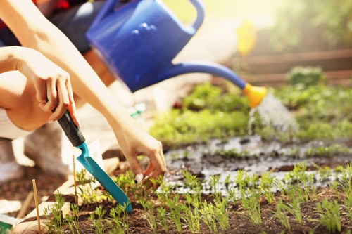 Gardener reviewing insurance documentation on clipboard